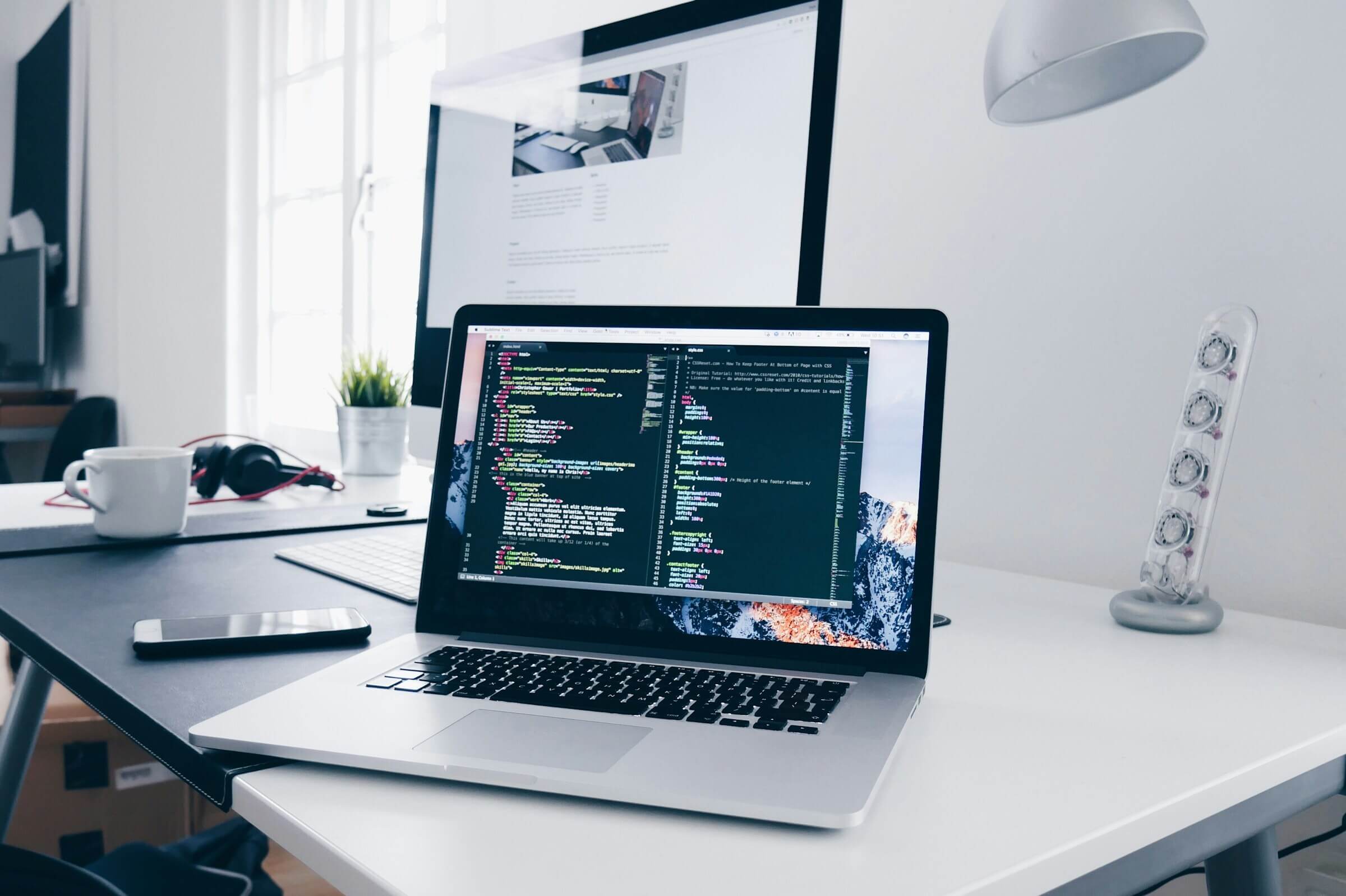Laptop with code on the screen on the desk