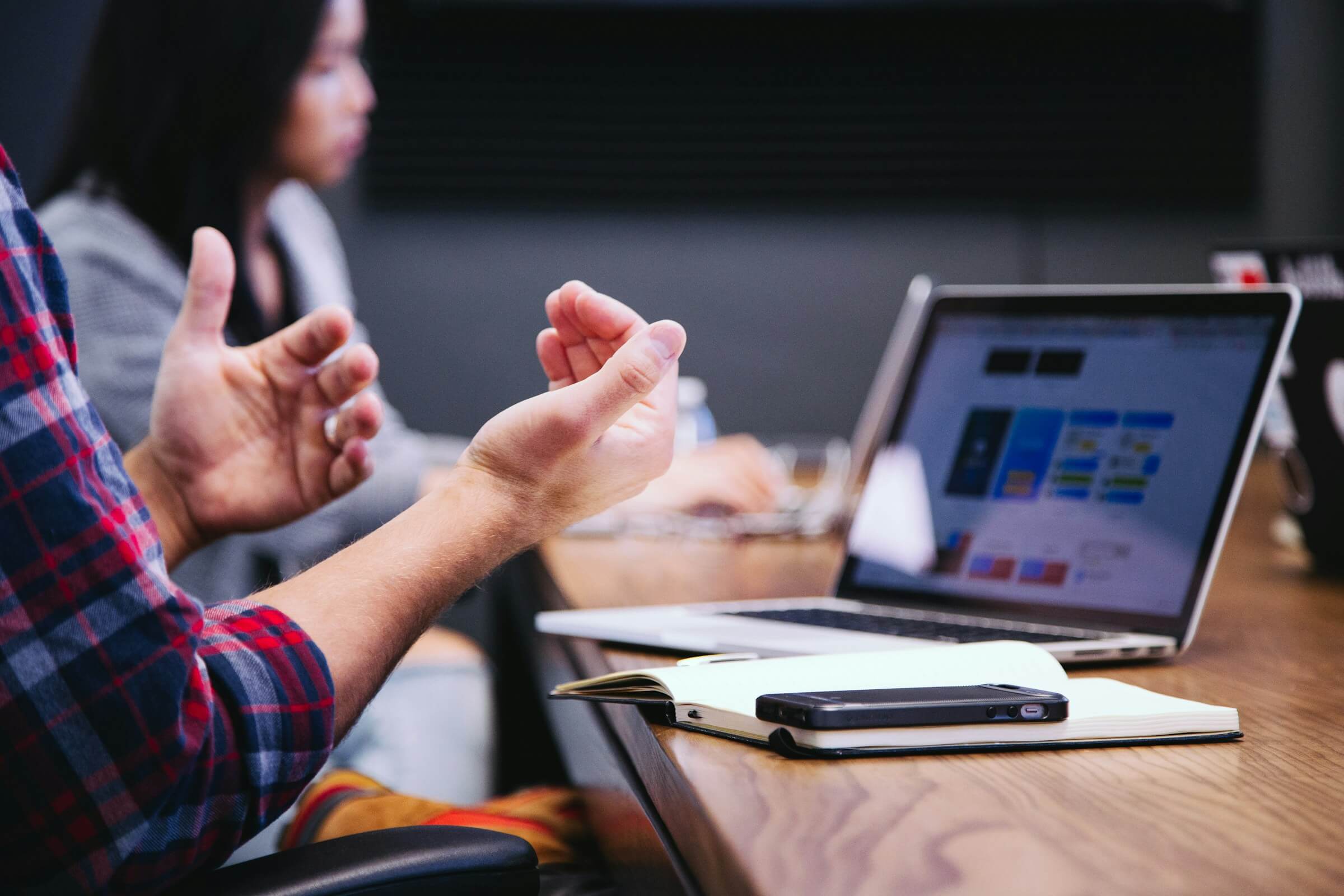 A person leading a business meeting